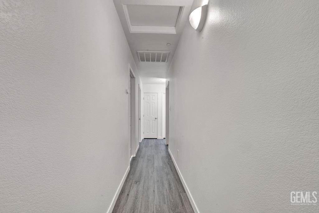 Undisclosed Address McFarland, CA 93250 - Photo 30 of 35 a view of a hallway with wooden floor