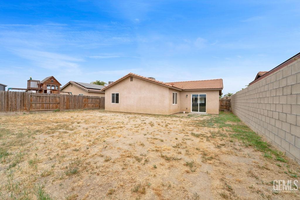 Undisclosed Address McFarland, CA 93250 - Photo 33 of 35 a view of a house with a yard