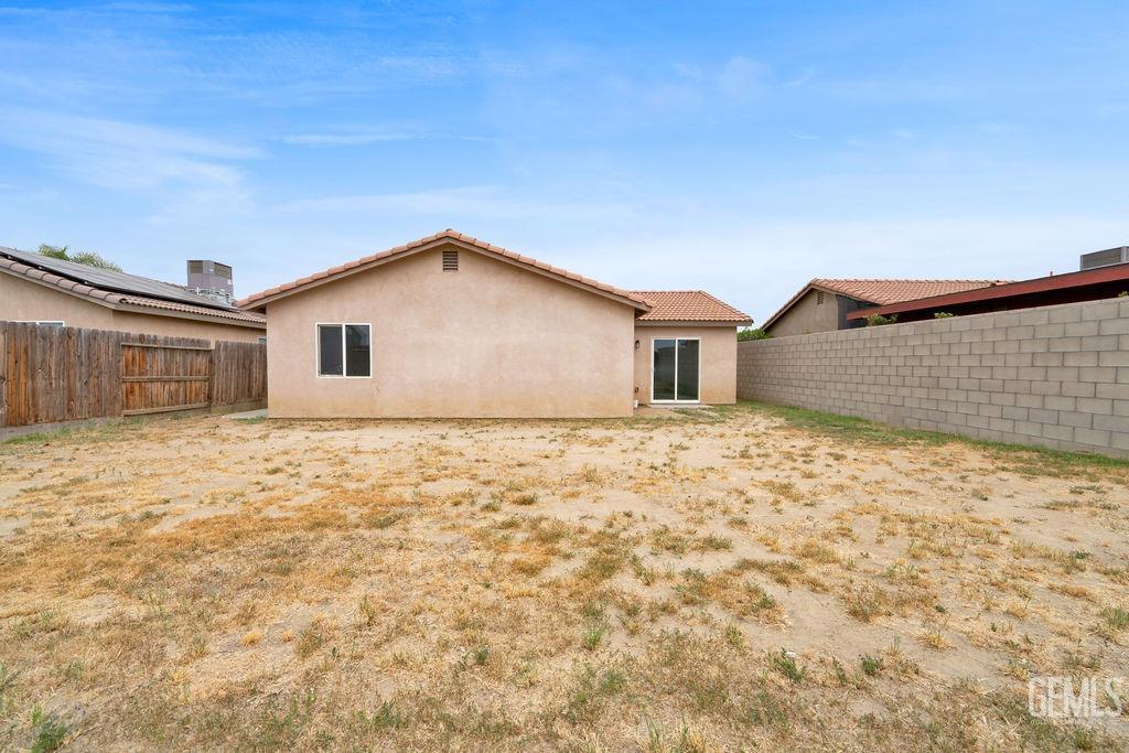 Undisclosed Address McFarland, CA 93250 - Photo 34 of 35 a big house with a big yard and large tree