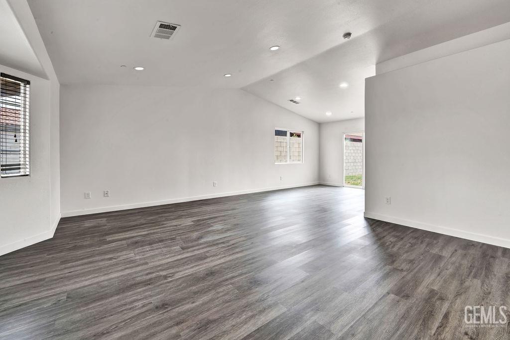 Undisclosed Address McFarland, CA 93250 - Photo 4 of 35 an empty room with wooden floor and windows