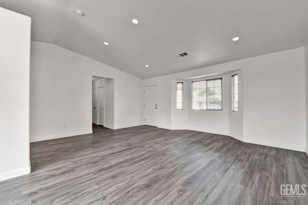 Undisclosed Address McFarland, CA 93250 - Photo 6 of 35 a view of an empty room with wooden floor and a window