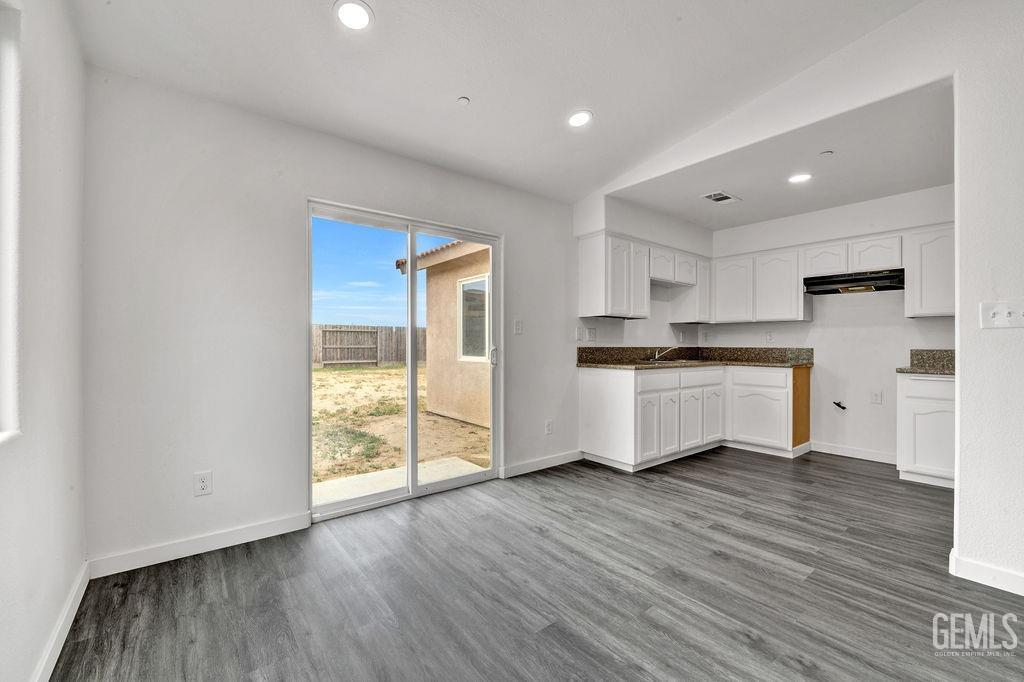 Undisclosed Address McFarland, CA 93250 - Photo 7 of 35 a kitchen with a refrigerator and window