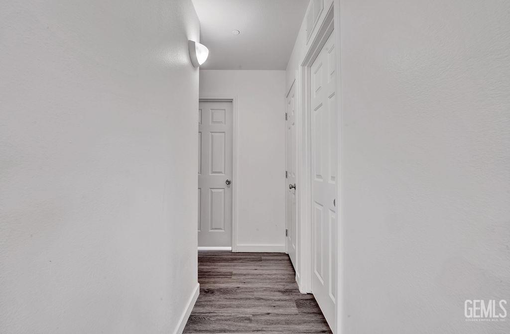 Undisclosed Address McFarland, CA 93250 - Photo 10 of 35 a view of a hallway with wooden floor