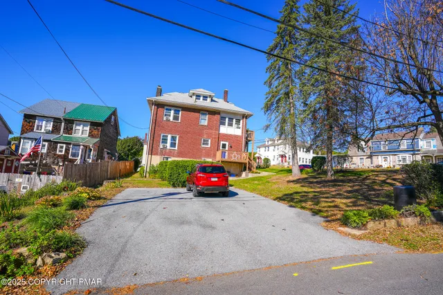 a view of a road with a building in the background