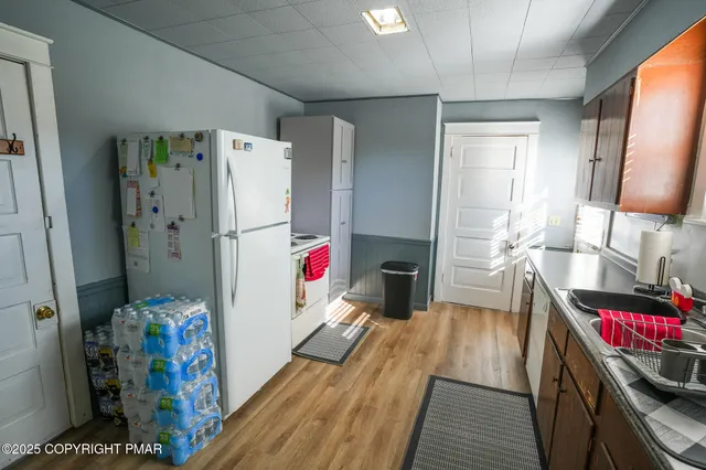 a kitchen with a sink cabinets and window