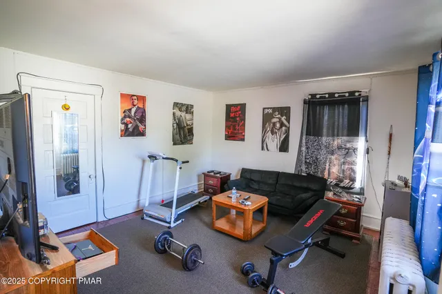 a room with furniture and a flat screen tv