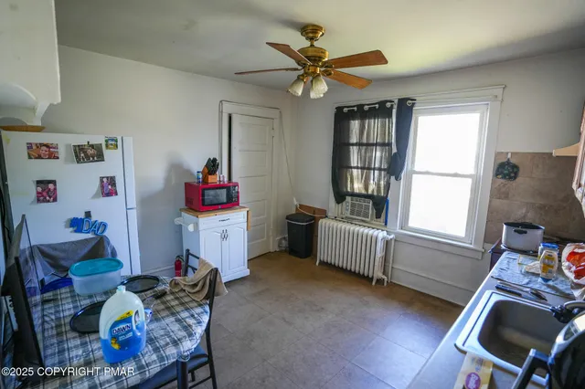 a bedroom with furniture and a window