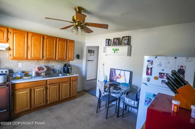 a bathroom with a sink a toilet and a shower