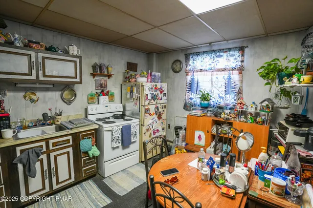 a bathroom with a toilet and a mirror