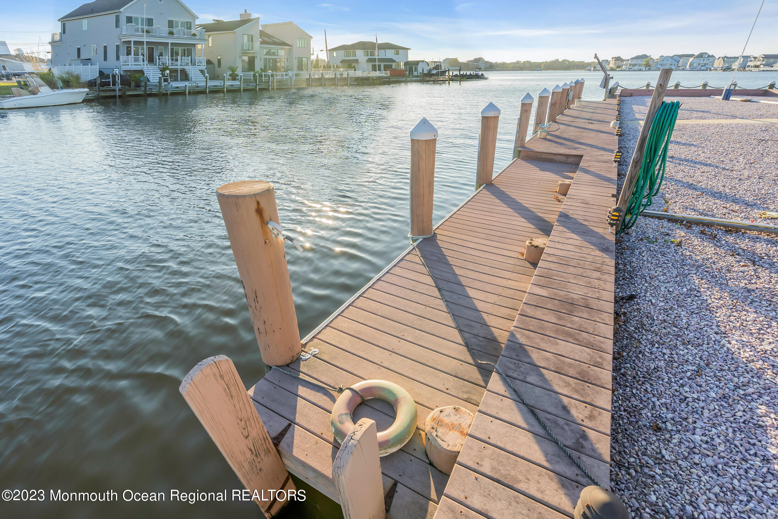2 Channel Road Toms River, NJ 08753 - Photo 41 of 57 a view of a lake with a deck