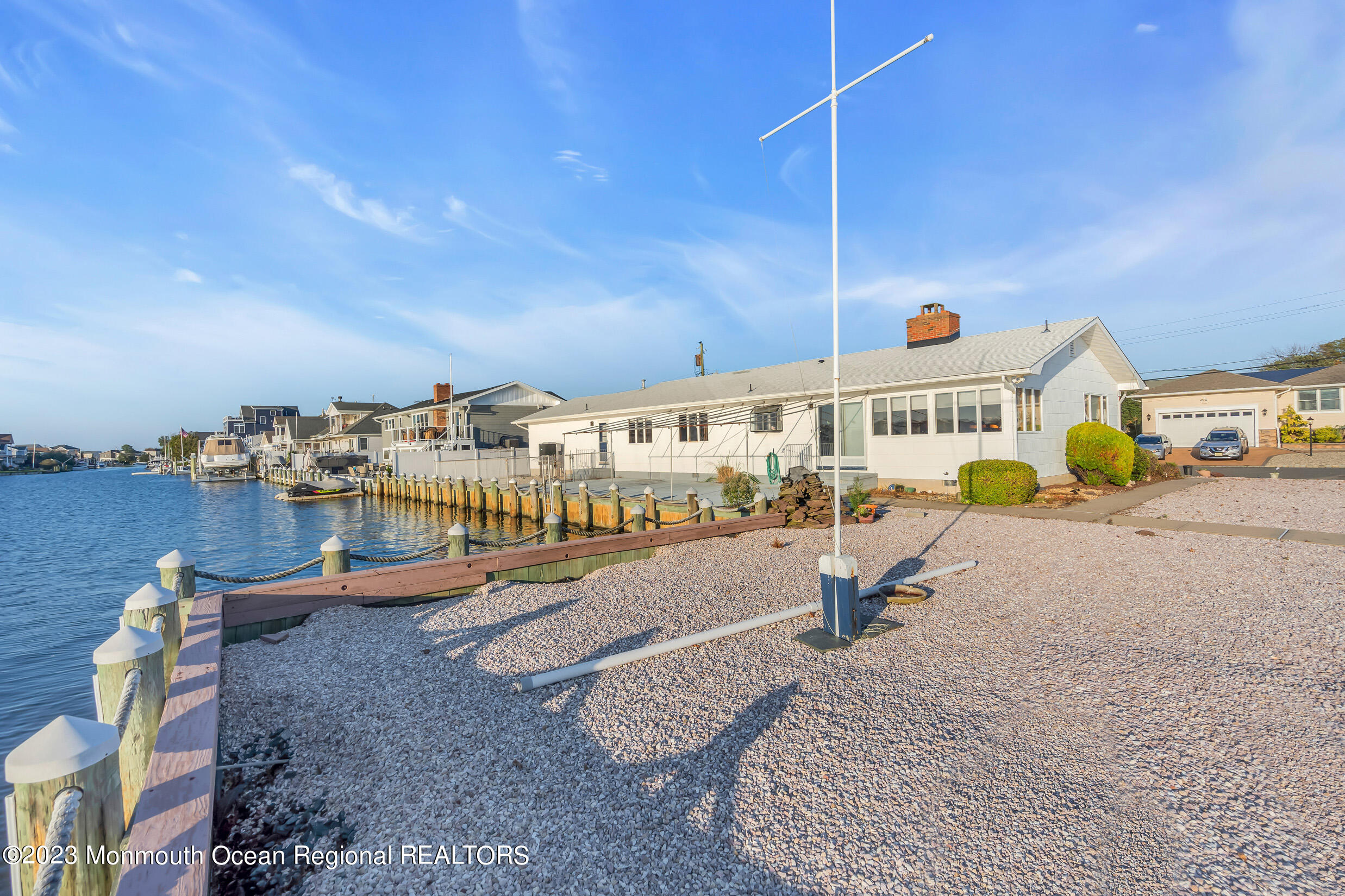 2 Channel Road Toms River, NJ 08753 - Photo 47 of 57 a view of a swimming pool with an outdoor seating