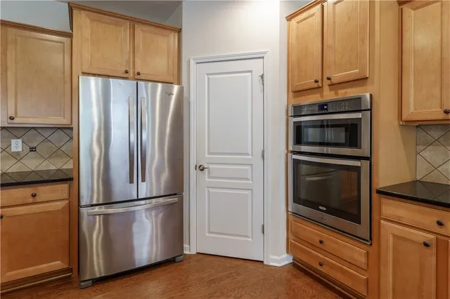 a kitchen with granite countertop cabinets and a sink
