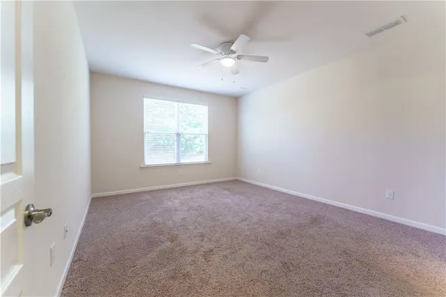 a kitchen with stainless steel appliances granite countertop a refrigerator a sink and a stove