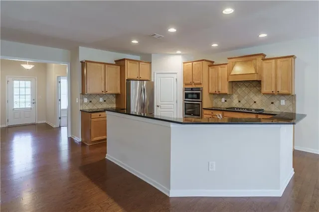 a view of entryway with wooden floor