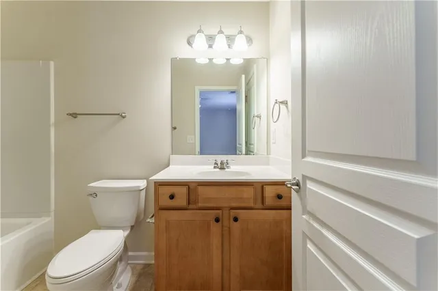 a white bath tub sitting next to a white toilet