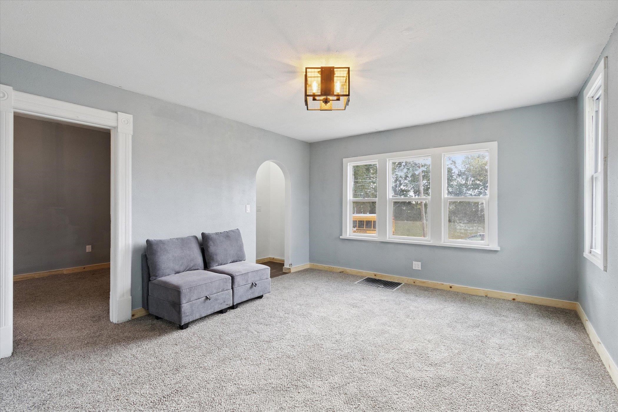 918 South 3rd Street Rockford, IL 61104 - Photo 13 of 27 a living room with furniture and a window