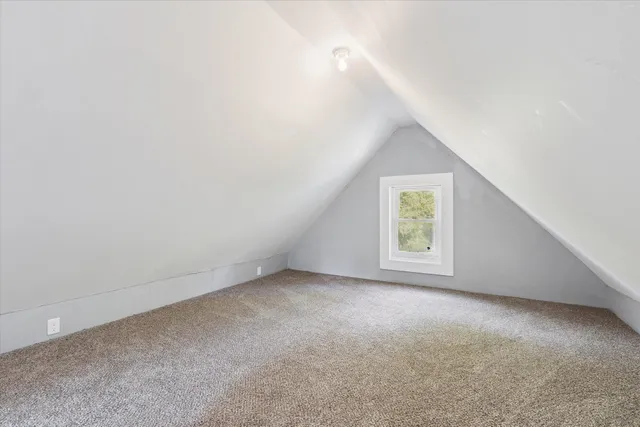 a view of an empty room with stairs