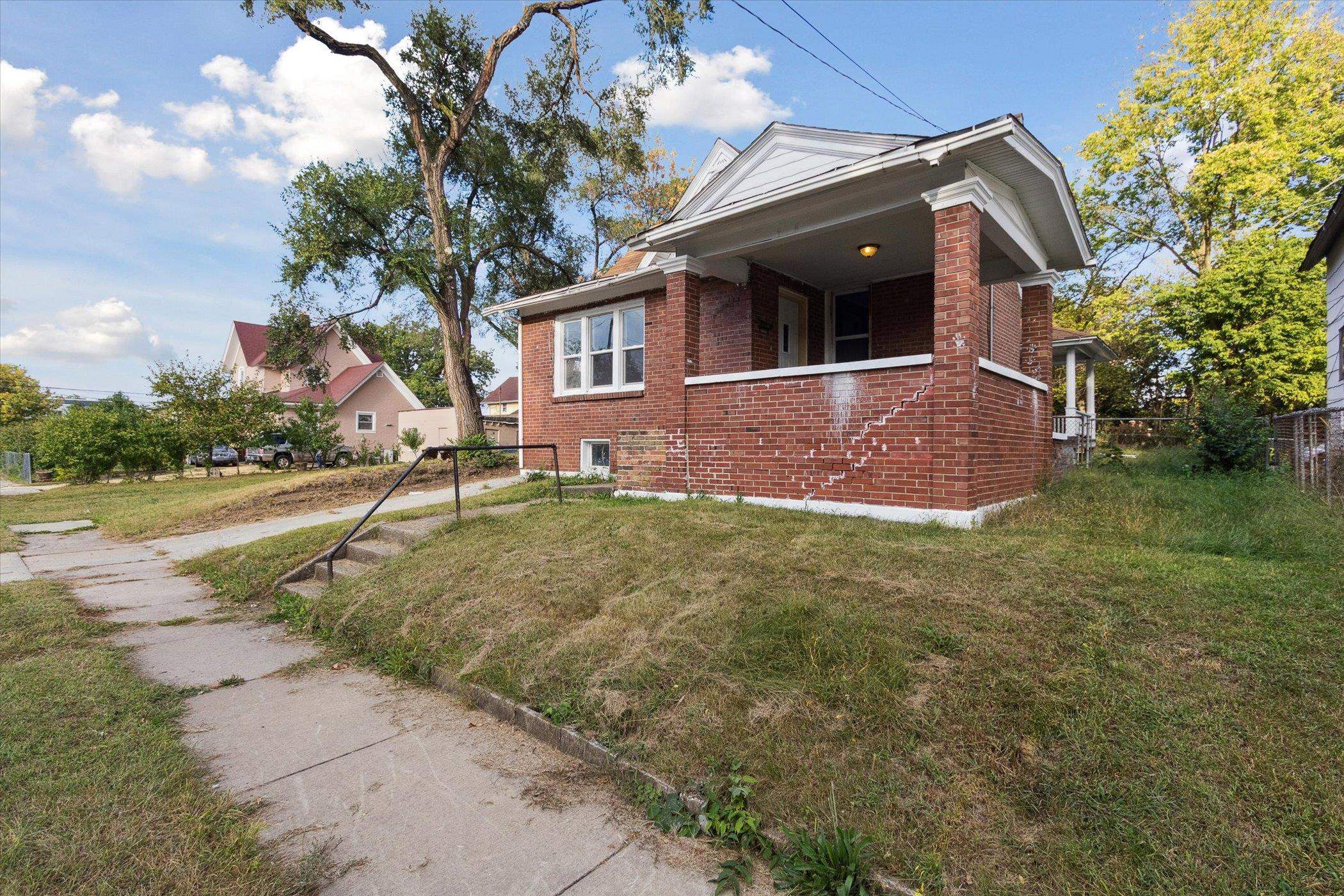 918 South 3rd Street Rockford, IL 61104 - Photo 7 of 27 a front view of a house with a yard