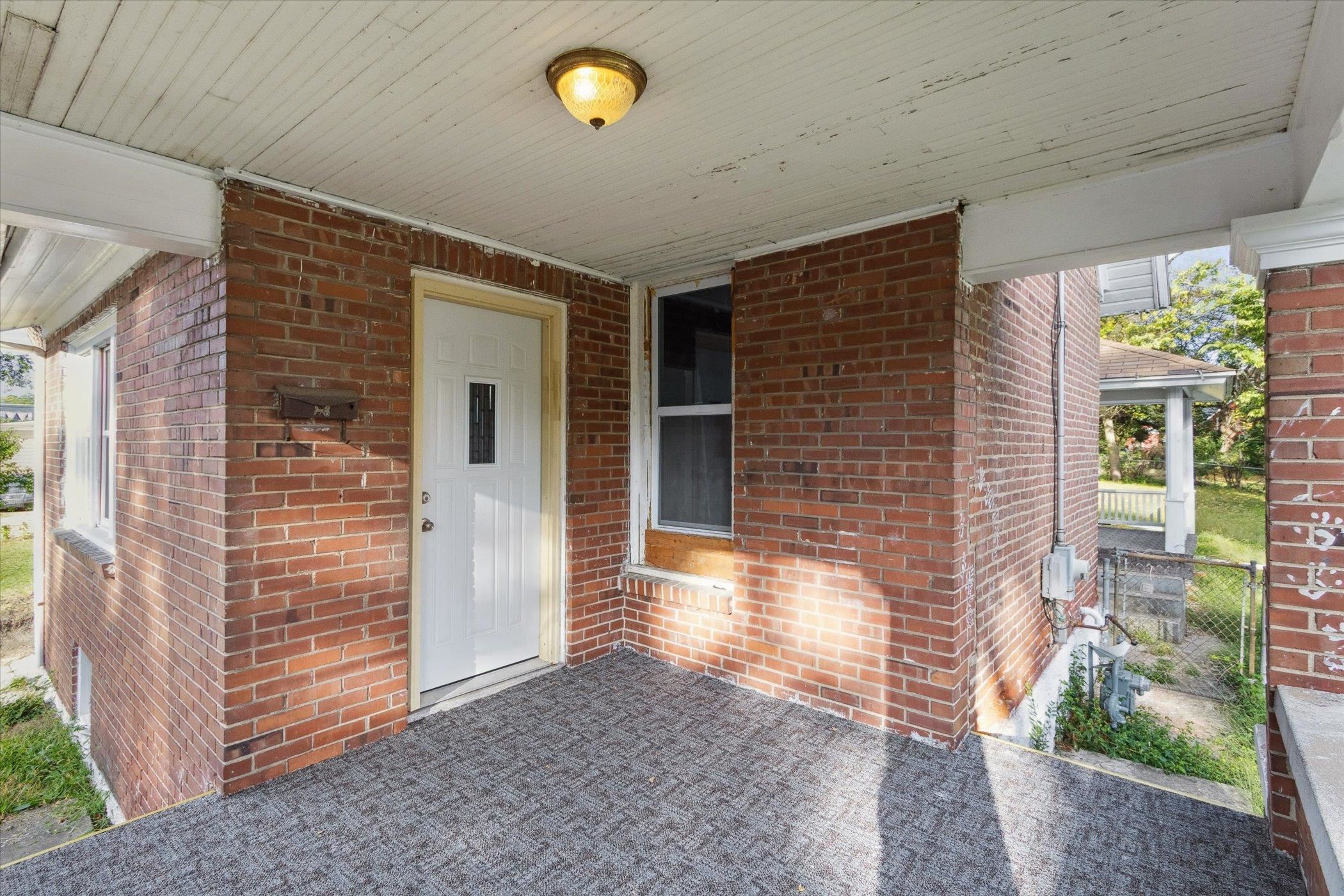 918 South 3rd Street Rockford, IL 61104 - Photo 8 of 27 a front view of a house with a yard
