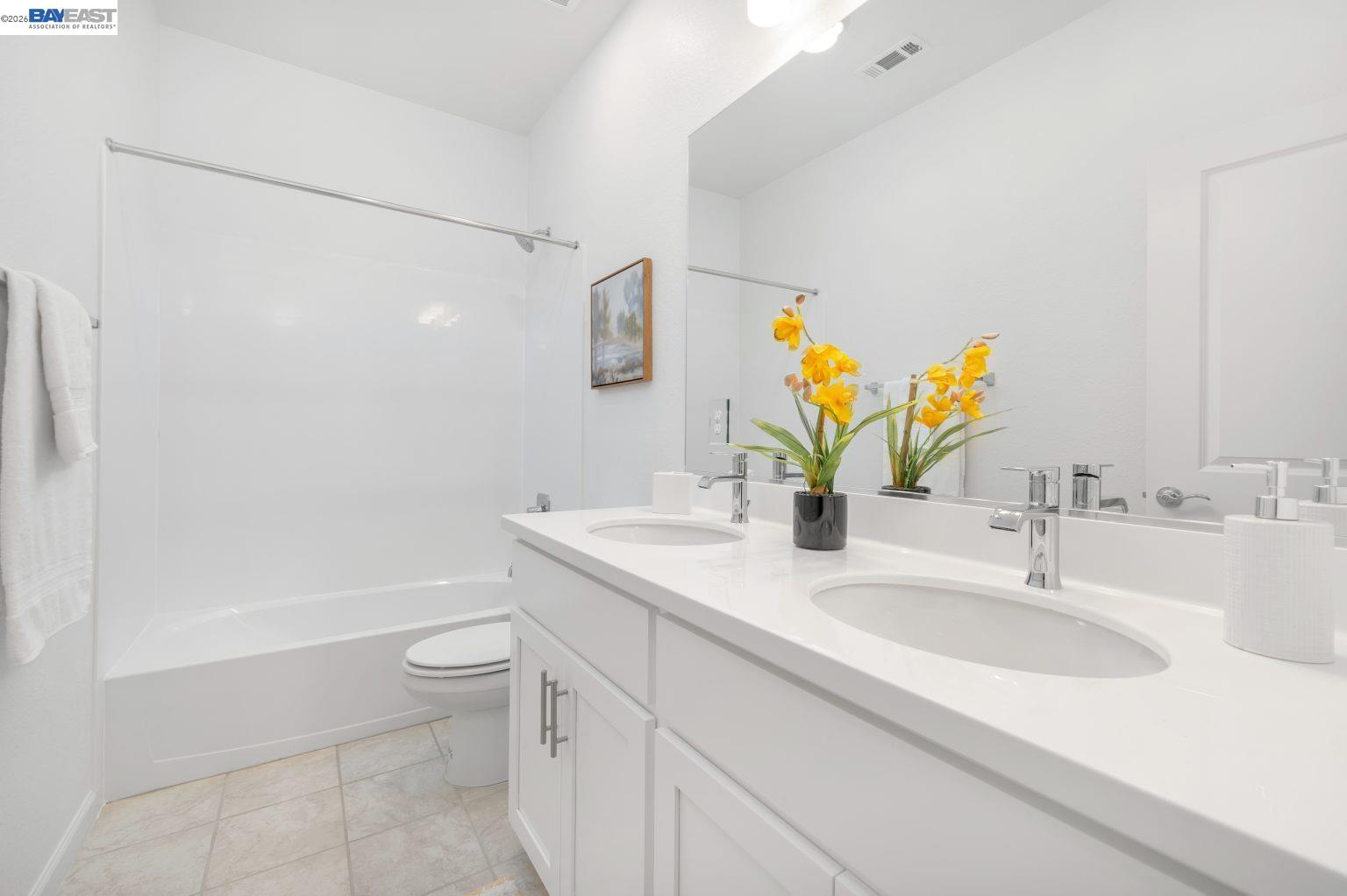 30 Cypress Way Pittsburg, CA 94565 - Photo 16 of 30 a bathroom with a granite countertop sink a toilet and a large mirror