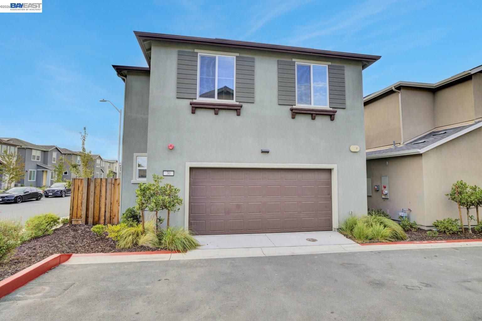 30 Cypress Way Pittsburg, CA 94565 - Photo 24 of 30 a front view of a house with a yard and garage