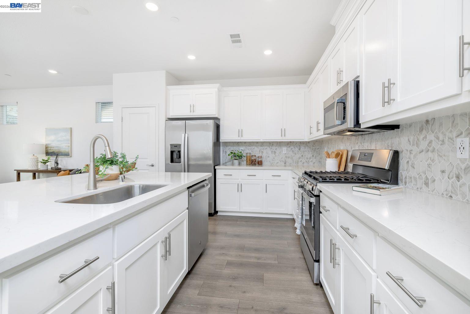 30 Cypress Way Pittsburg, CA 94565 - Photo 3 of 30 a kitchen with white cabinets and white appliances