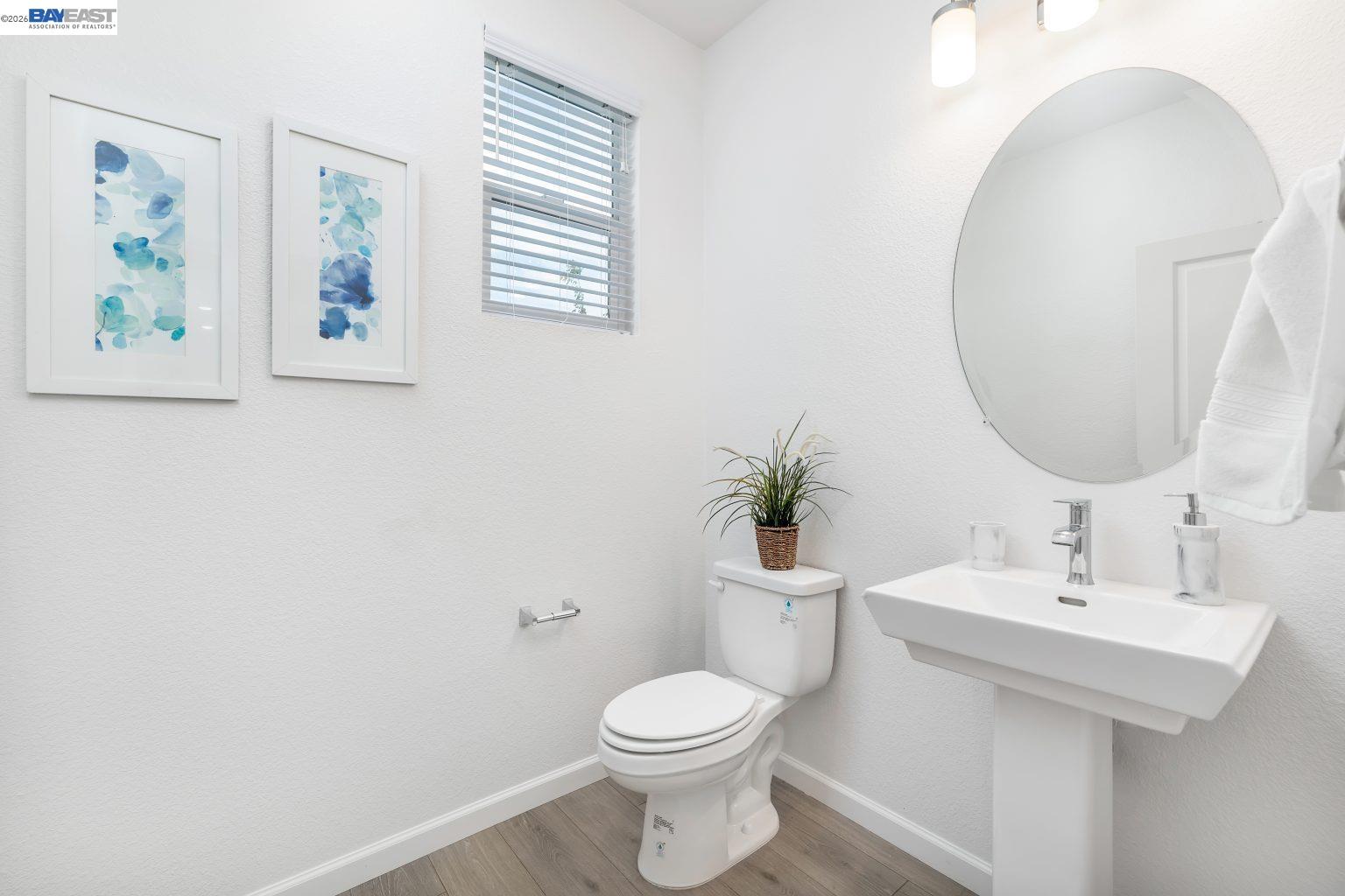 30 Cypress Way Pittsburg, CA 94565 - Photo 8 of 30 a bathroom with a toilet a sink and mirror