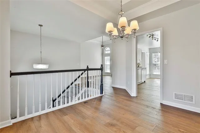 a kitchen with granite countertop a refrigerator and a sink