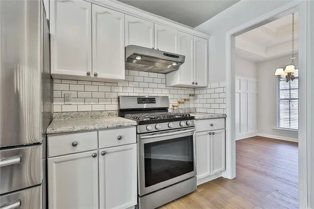 a bathroom with a tub a sink and a shower