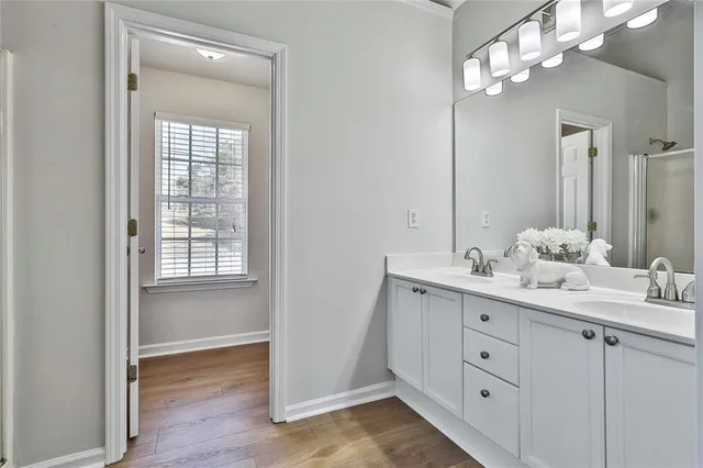 a bathroom with a sink a vanity and a mirror