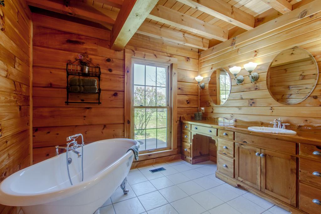 1567 Dillon Road Milton, TN 37118 - Photo 16 of 30 a bathroom with a tub sink and mirror