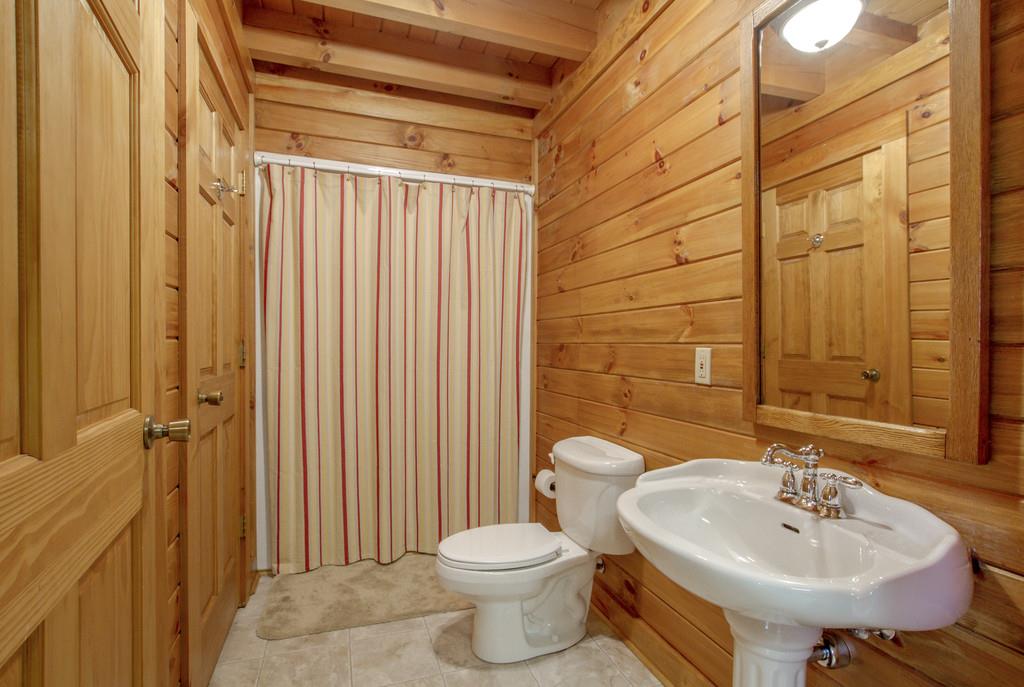 1567 Dillon Road Milton, TN 37118 - Photo 18 of 30 a bathroom with a sink a toilet and shower curtain
