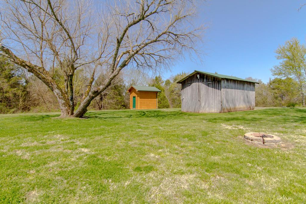 1567 Dillon Road Milton, TN 37118 - Photo 26 of 30 a view of a back yard of the house with a small yard