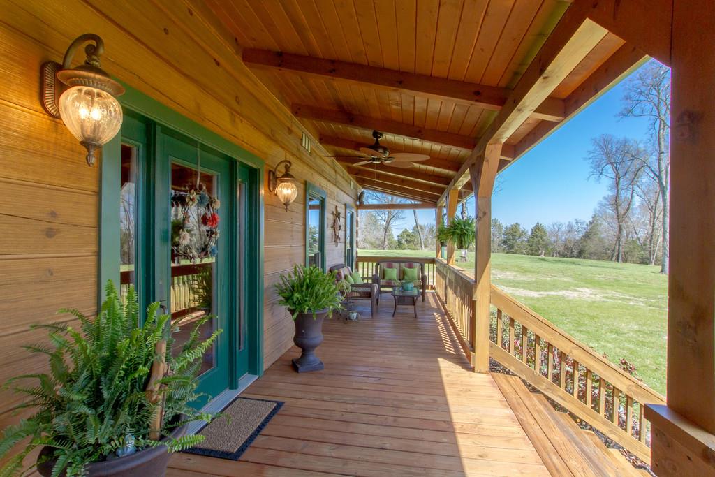 1567 Dillon Road Milton, TN 37118 - Photo 5 of 30 a view of a porch with furniture and garden