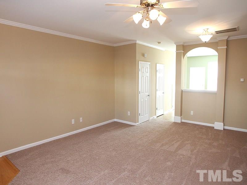 8458 Reedy Ridge Lane Raleigh, NC 27613 - Photo 2 of 12 a view of an empty room with a window