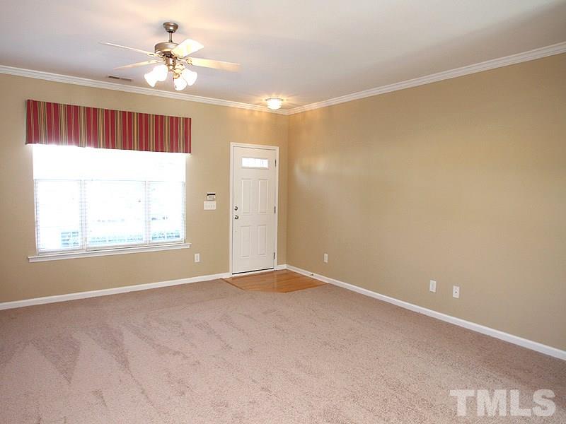 8458 Reedy Ridge Lane Raleigh, NC 27613 - Photo 3 of 12 a view of an empty room with a window