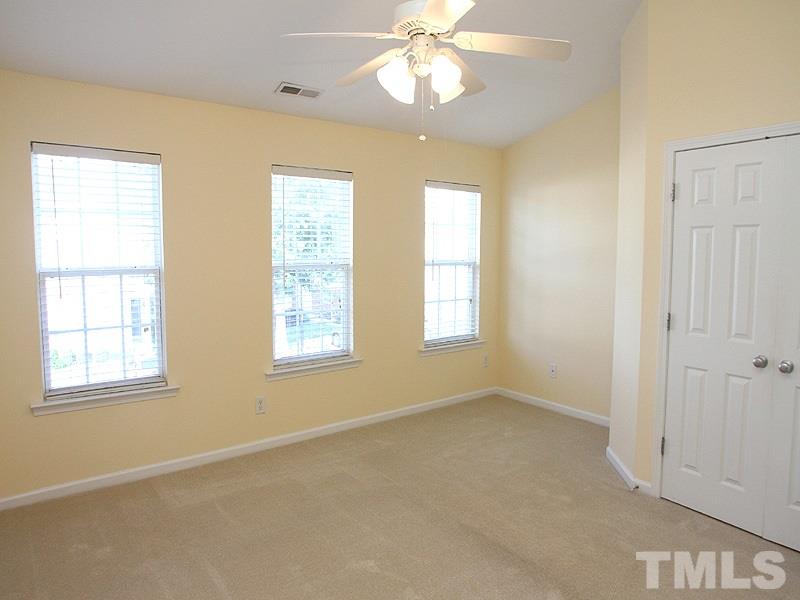 8458 Reedy Ridge Lane Raleigh, NC 27613 - Photo 9 of 12 a view of an empty room with a window