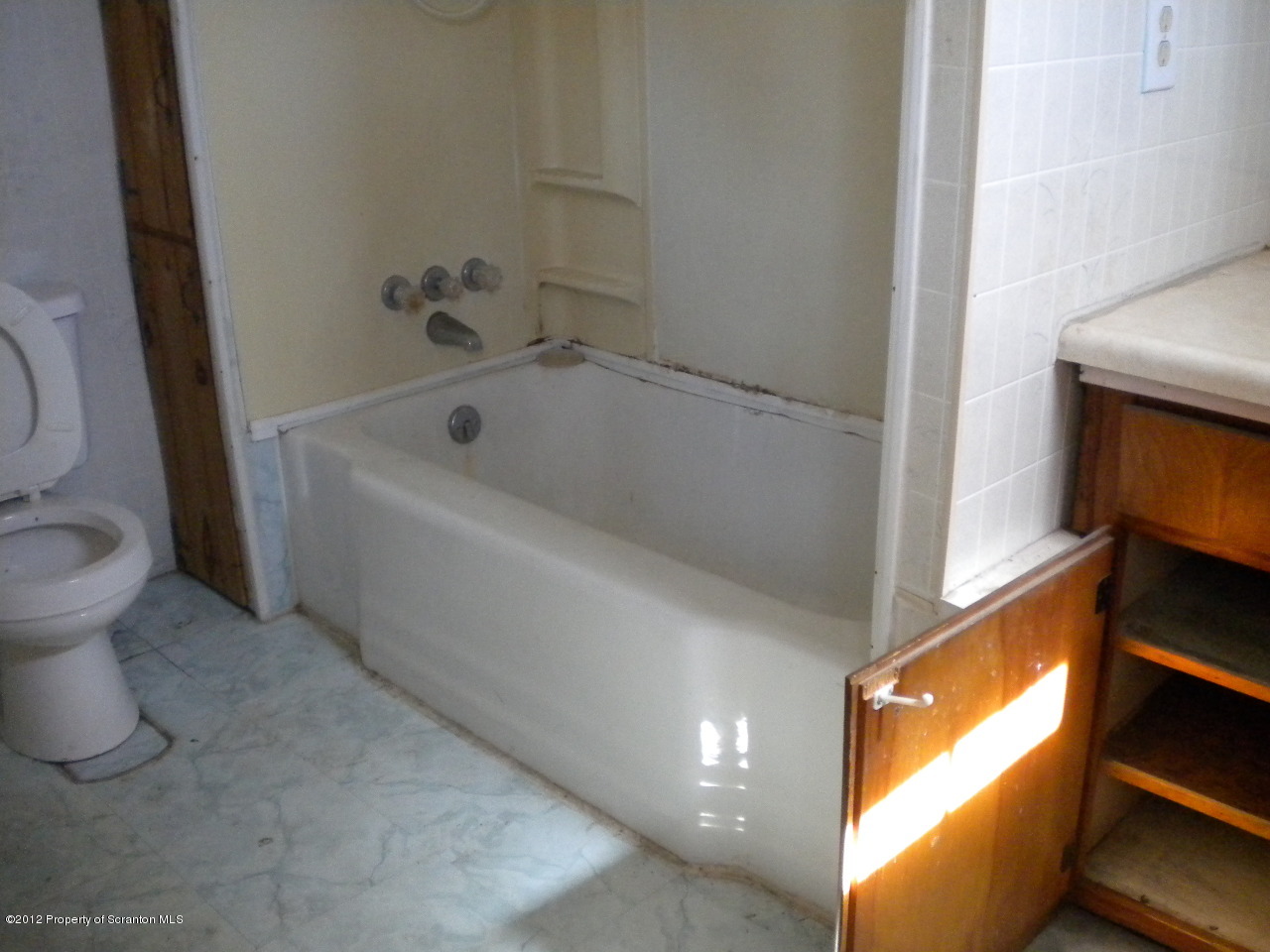 53 Lindaville Road Kingsley, PA 18826 - Photo 2 of 11 a white bath tub sitting next to a toilet