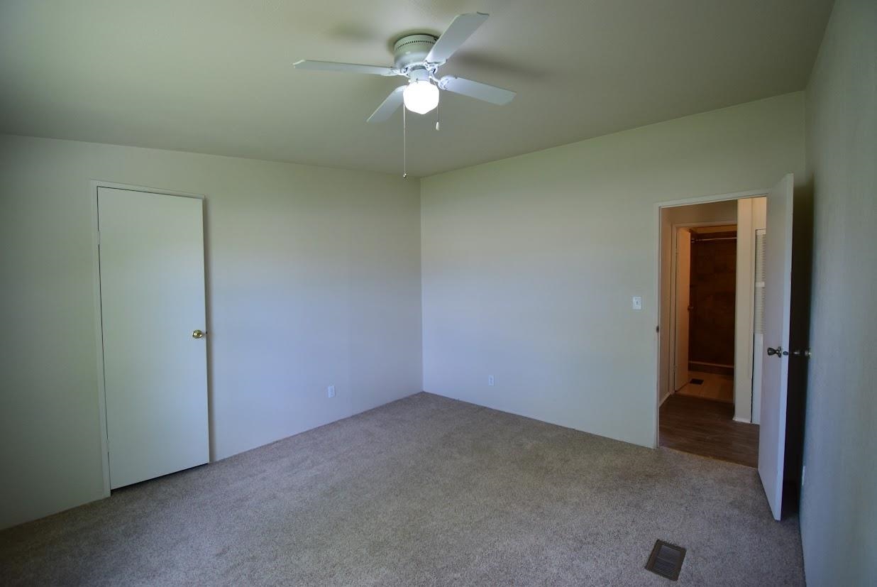 19548 B50 Road Delta, CO 81416 - Photo 20 of 37 an empty room with closet and a ceiling fan
