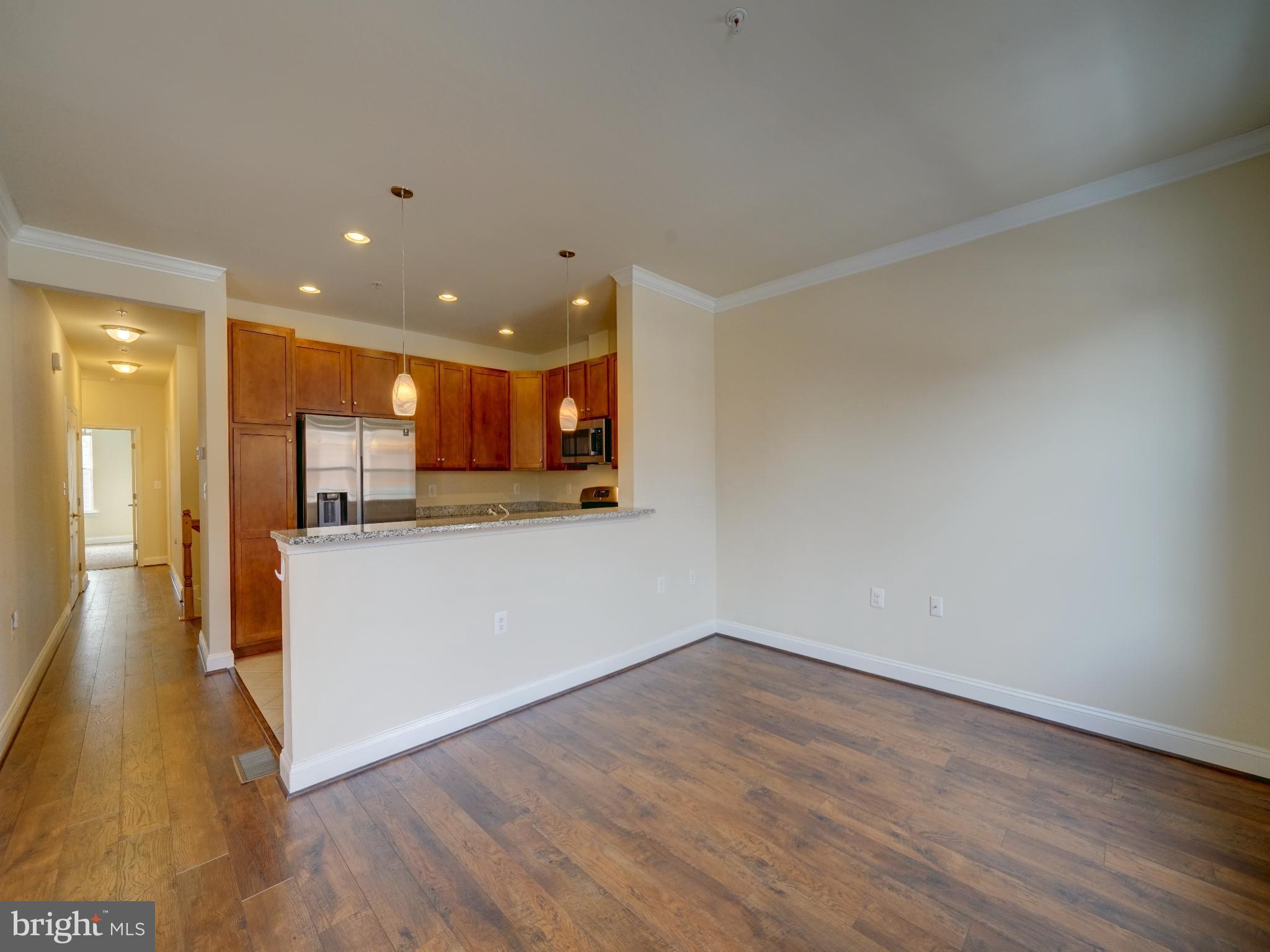 7672 Maple Lawn Boulevard, Unit 53 Fulton, MD 20759 - Photo 12 of 39 Modern open space with warm wood accents.