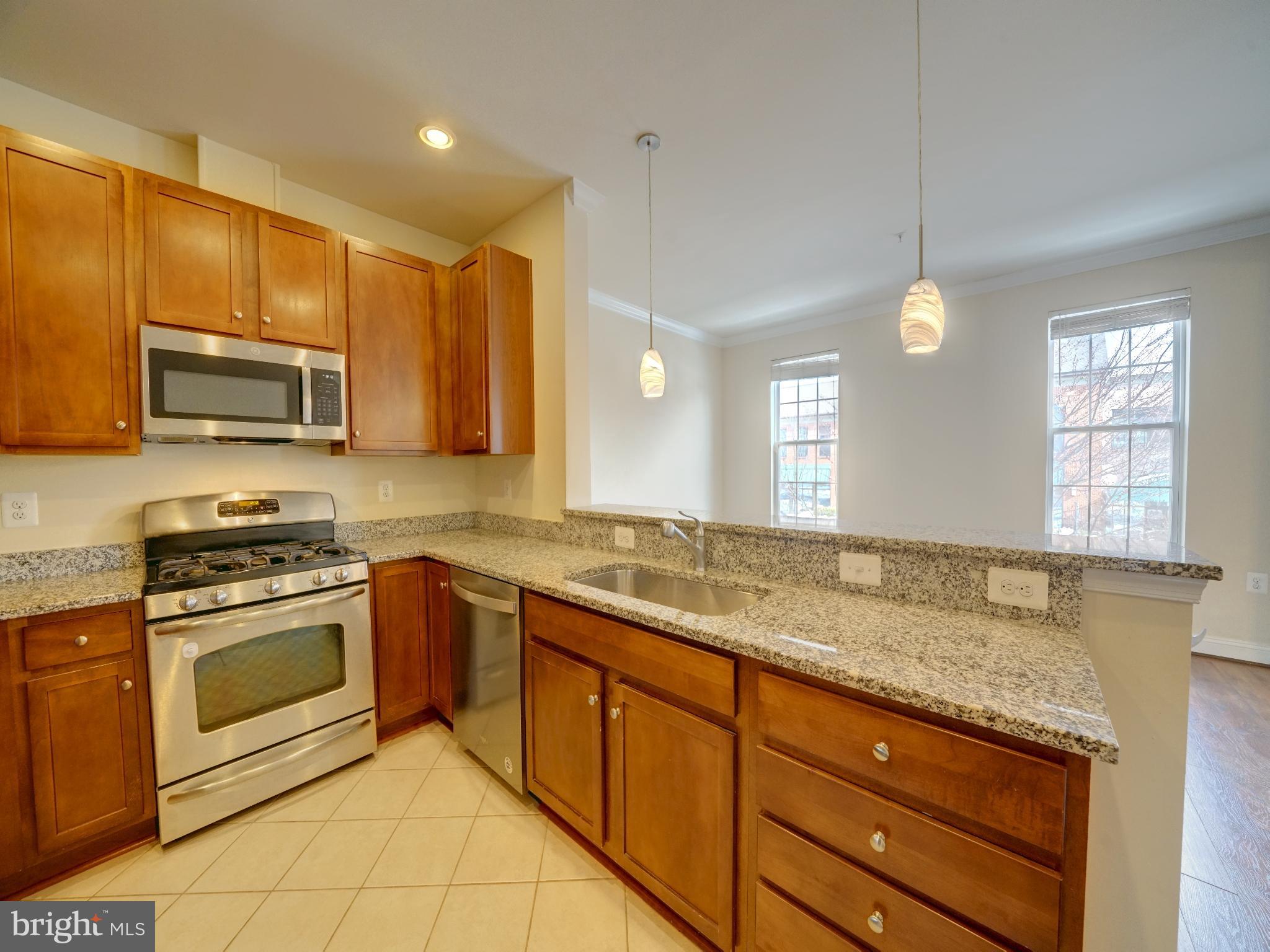 7672 Maple Lawn Boulevard, Unit 53 Fulton, MD 20759 - Photo 21 of 39 Modern kitchen with elegant finishes.