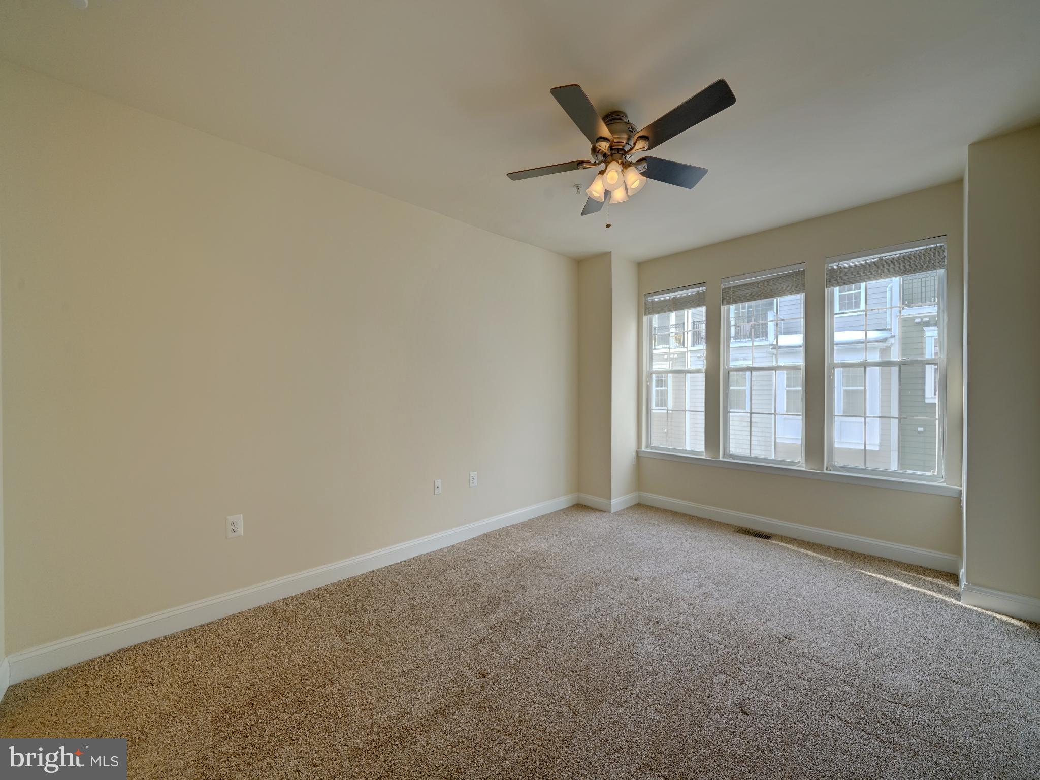7672 Maple Lawn Boulevard, Unit 53 Fulton, MD 20759 - Photo 29 of 39 Spacious room with natural light and ceiling fan.