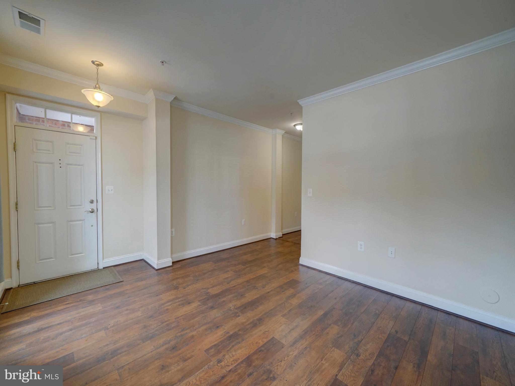 7672 Maple Lawn Boulevard, Unit 53 Fulton, MD 20759 - Photo 3 of 39 Spacious entryway with warm wood floors.