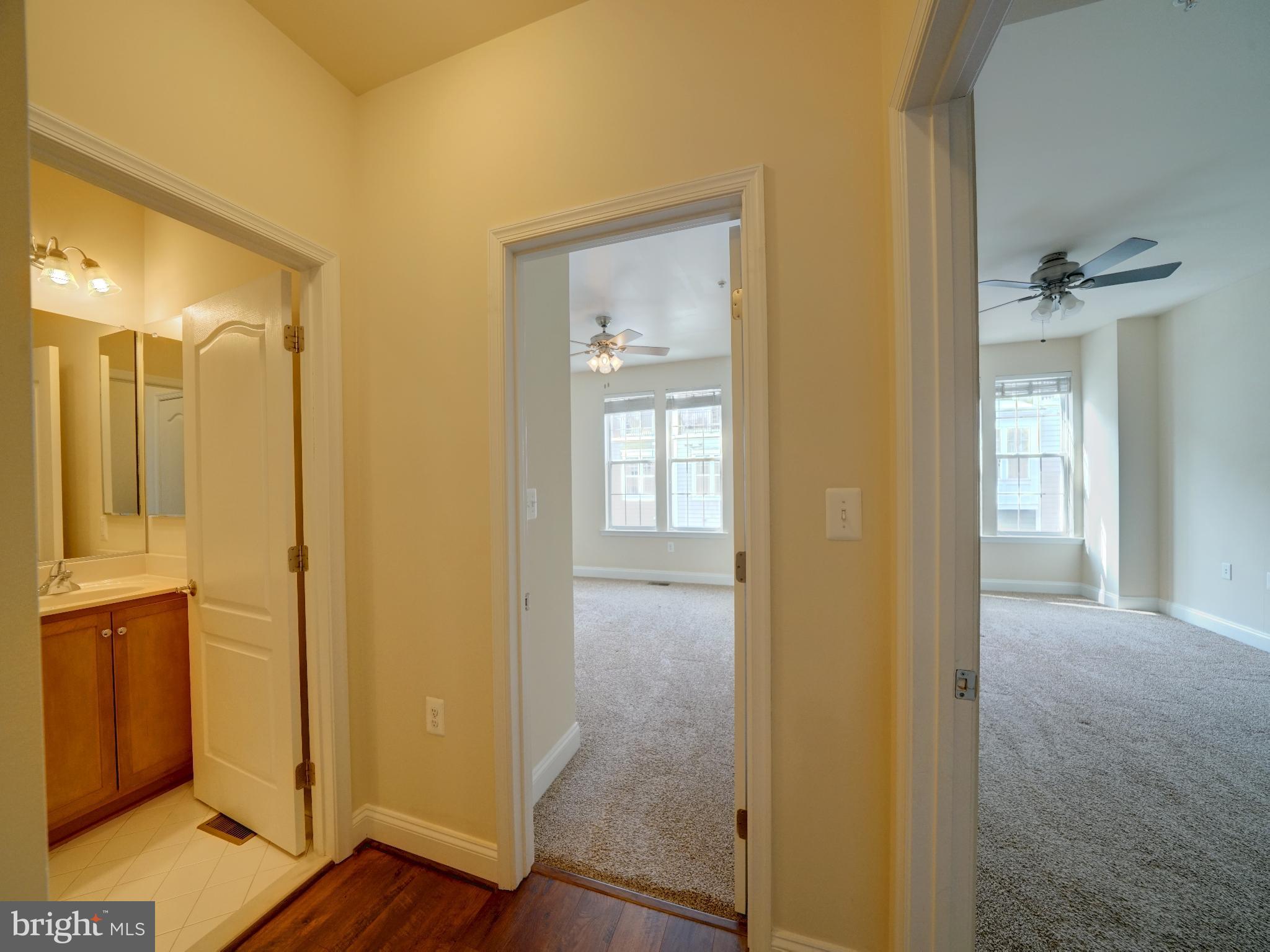 7672 Maple Lawn Boulevard, Unit 53 Fulton, MD 20759 - Photo 36 of 39 Bright and inviting hallway with open doors.