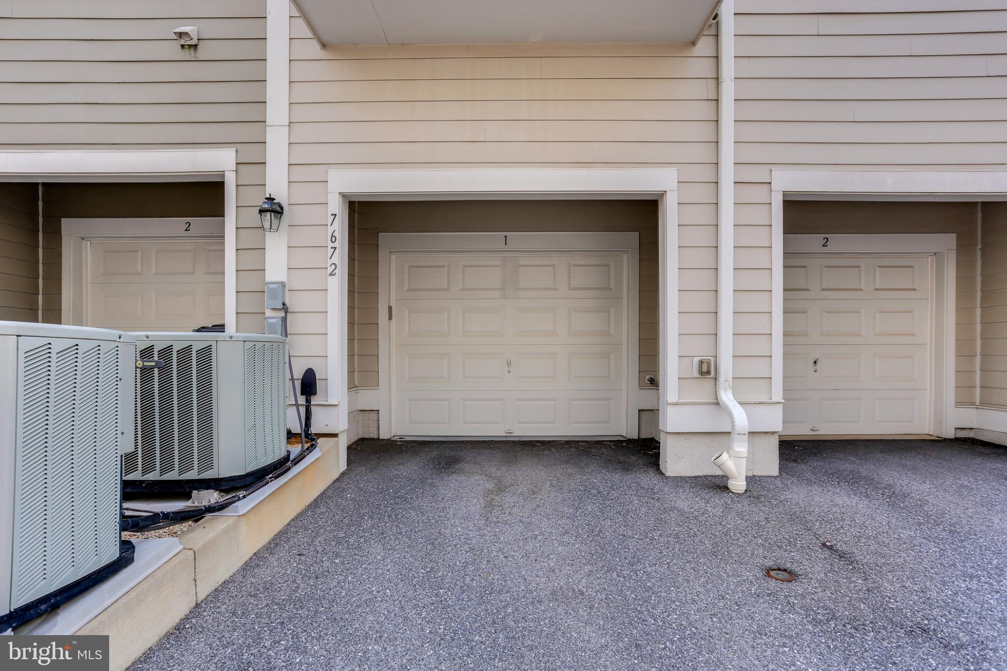 7672 Maple Lawn Boulevard, Unit 53 Fulton, MD 20759 - Photo 39 of 39 Charming garage entry in a serene setting.