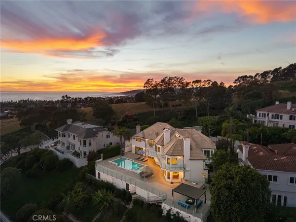 an aerial view of a house with a big yard