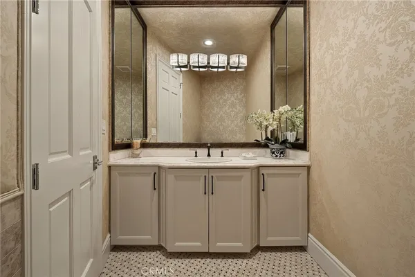 a view of a workspace with furniture and a large window