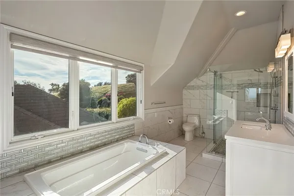 a bedroom with a bed and a desk