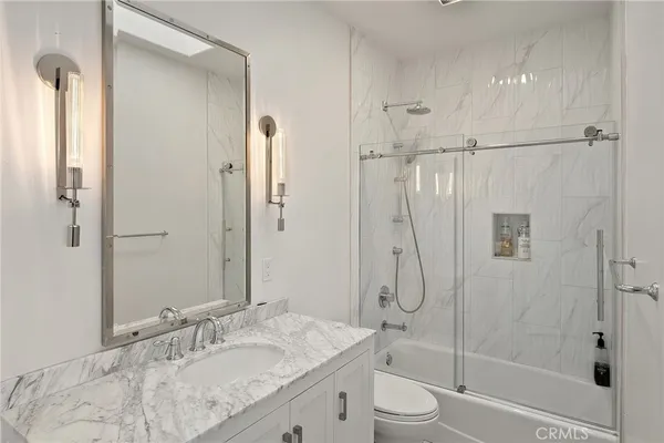 a view of a swimming pool with an outdoor seating and a yard