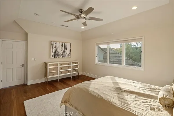 a patio with a table and chairs under an umbrella